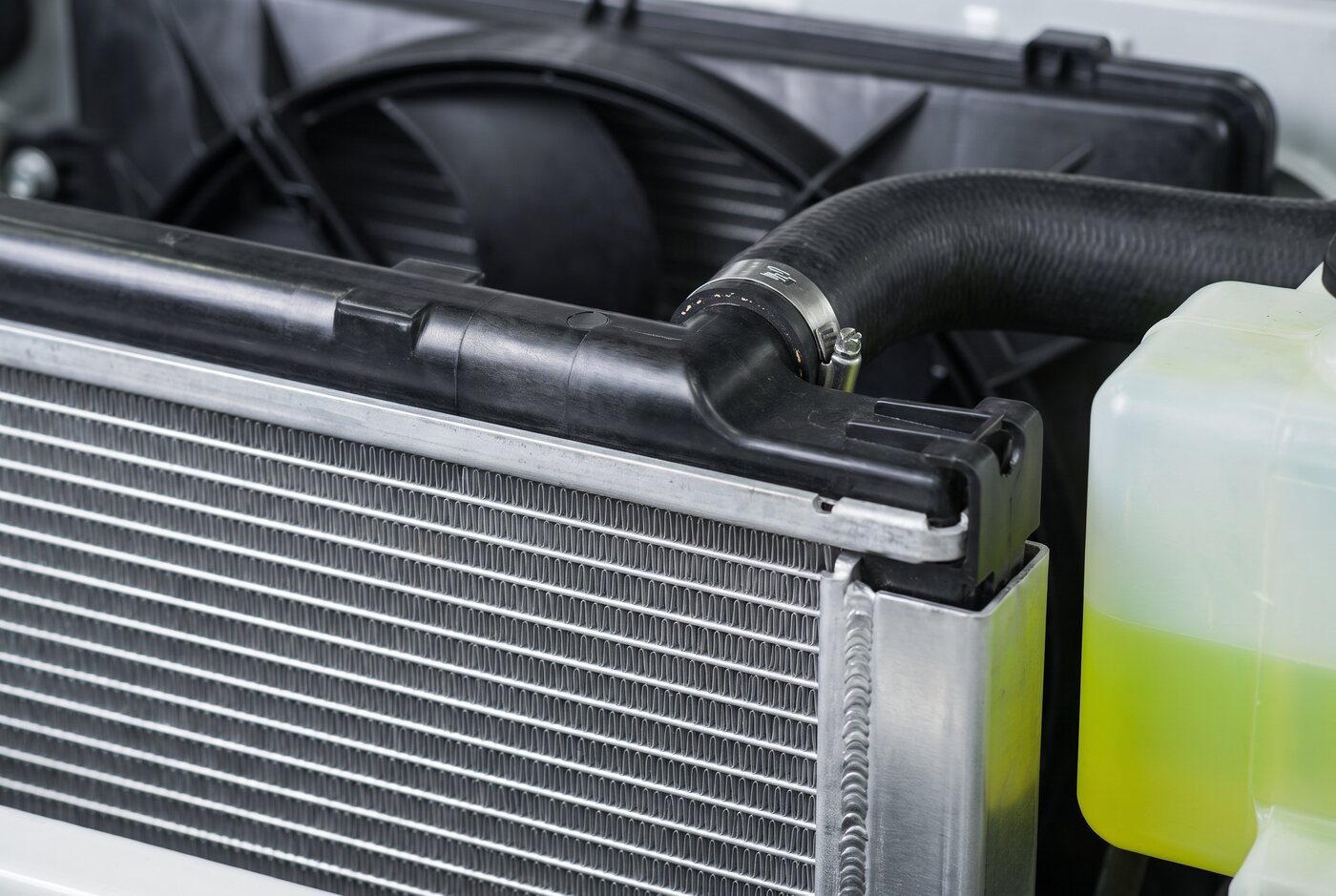 Engine coolant in an overflow reservoir beside the radiator